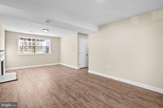 unfurnished living room featuring hardwood / wood-style flooring