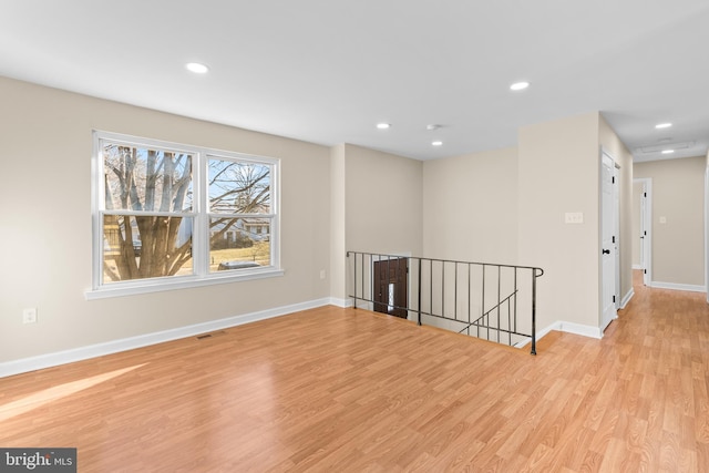 unfurnished room featuring light hardwood / wood-style flooring