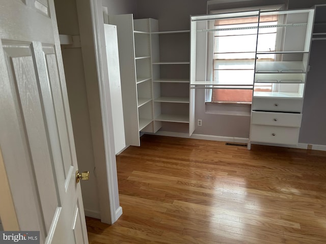 walk in closet featuring light wood-type flooring