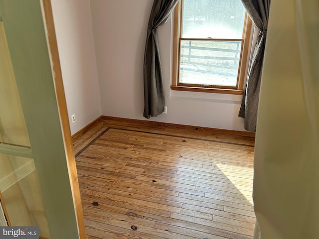 spare room with light hardwood / wood-style floors