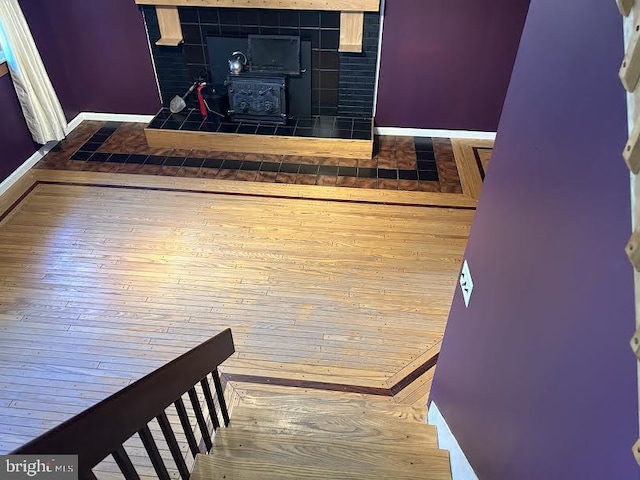 interior space featuring hardwood / wood-style floors and a wood stove