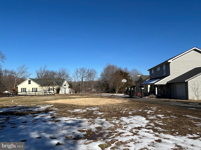 view of yard covered in snow