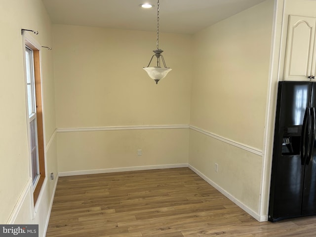 unfurnished dining area with hardwood / wood-style floors