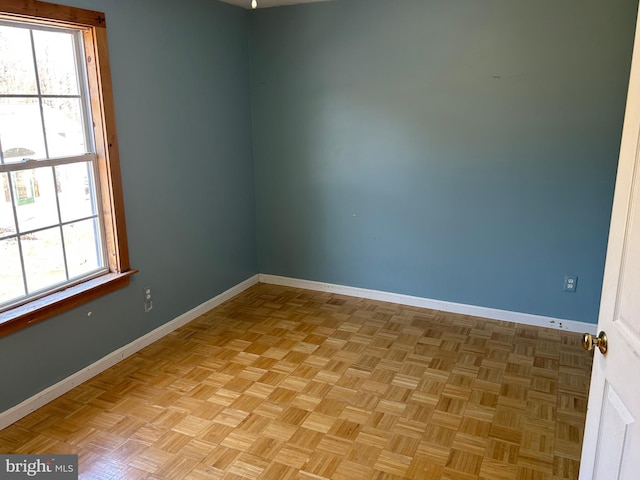 spare room featuring light parquet floors