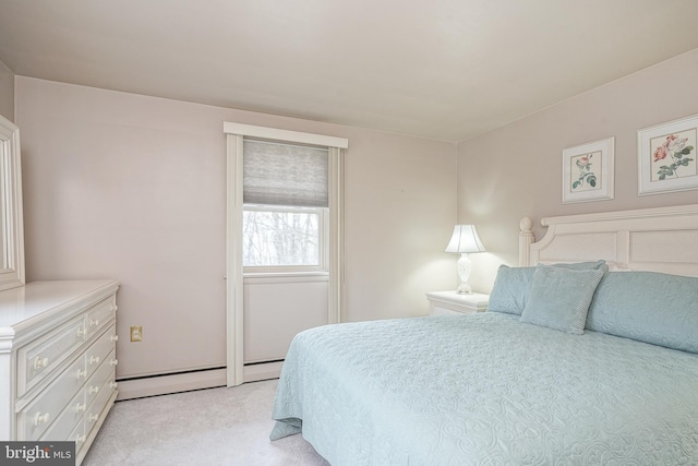 bedroom featuring light carpet and a baseboard radiator