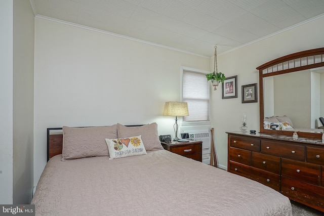 bedroom featuring ornamental molding and a wall mounted air conditioner