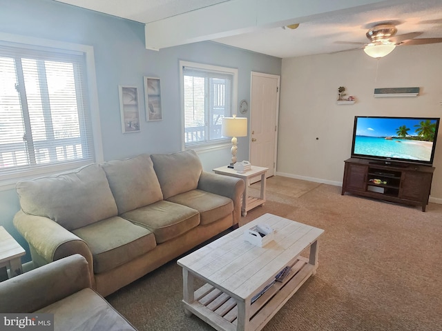 living room with carpet floors, ceiling fan, and plenty of natural light