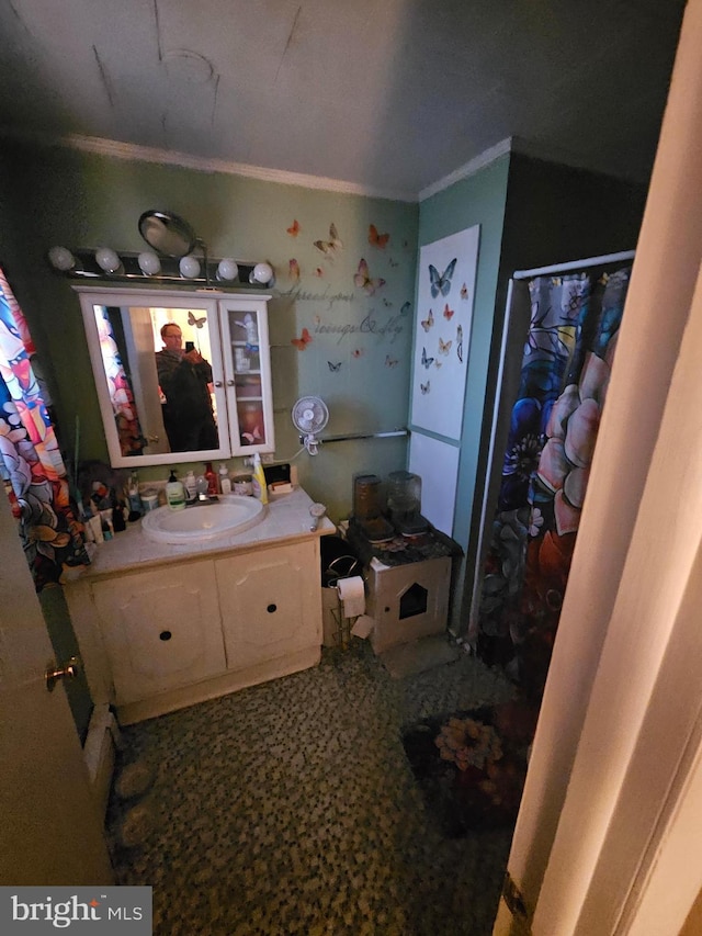 bathroom featuring vanity and ornamental molding