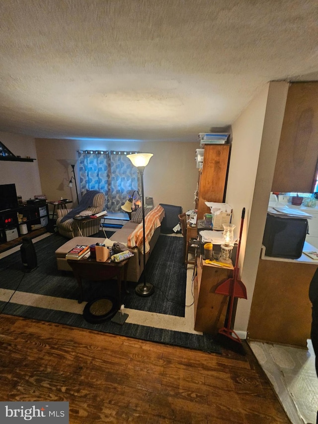 interior space with hardwood / wood-style flooring and a textured ceiling