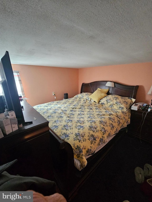 bedroom featuring a textured ceiling