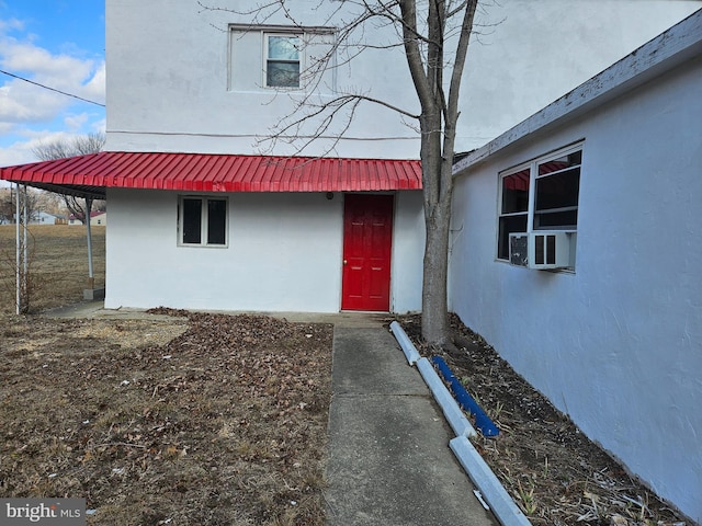 doorway to property with cooling unit