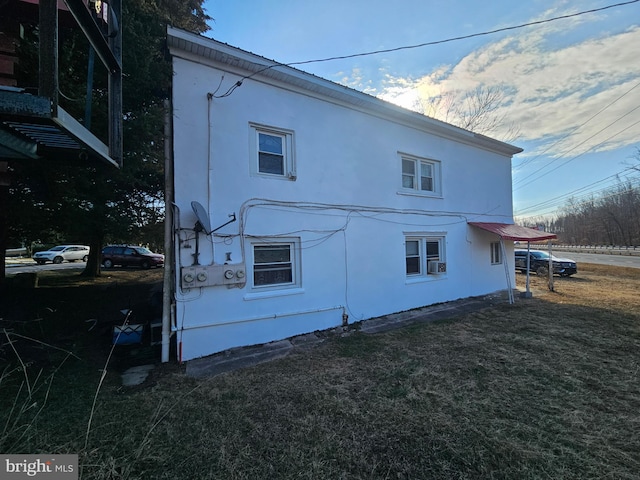 view of home's exterior featuring a lawn