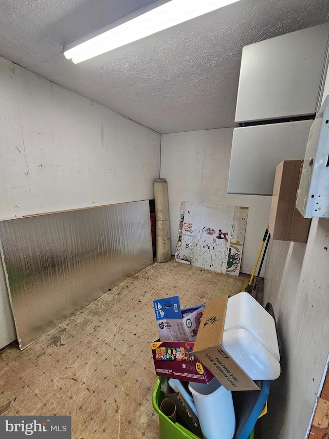 basement with a textured ceiling