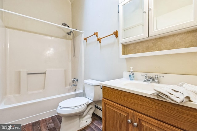 full bathroom with bathtub / shower combination, hardwood / wood-style flooring, vanity, baseboard heating, and toilet