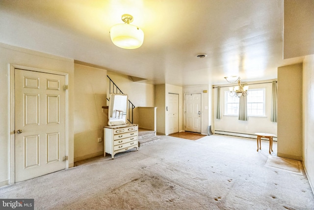 interior space featuring an inviting chandelier, a baseboard radiator, and light colored carpet