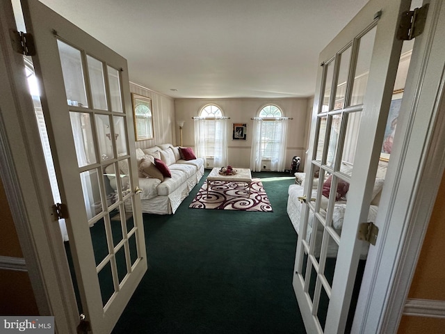 carpeted living room featuring french doors