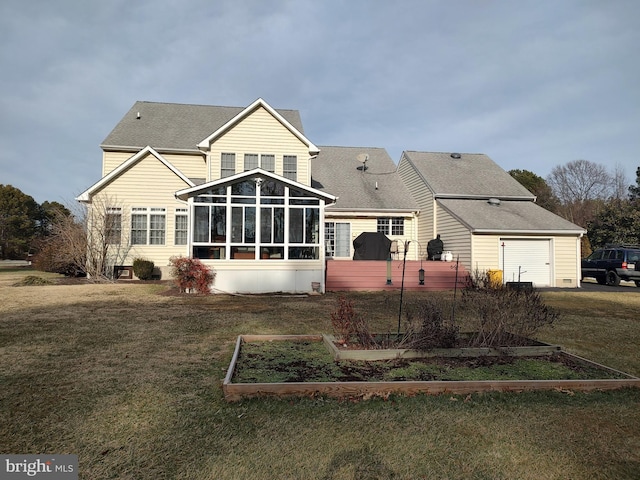 back of property with a lawn and a sunroom