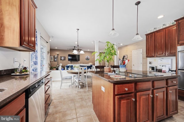 kitchen with dark stone countertops, hanging light fixtures, a center island, black electric stovetop, and stainless steel dishwasher