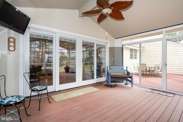 sunroom / solarium with lofted ceiling with beams and ceiling fan