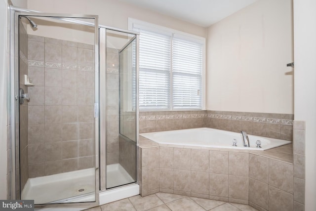 bathroom featuring separate shower and tub and tile patterned floors