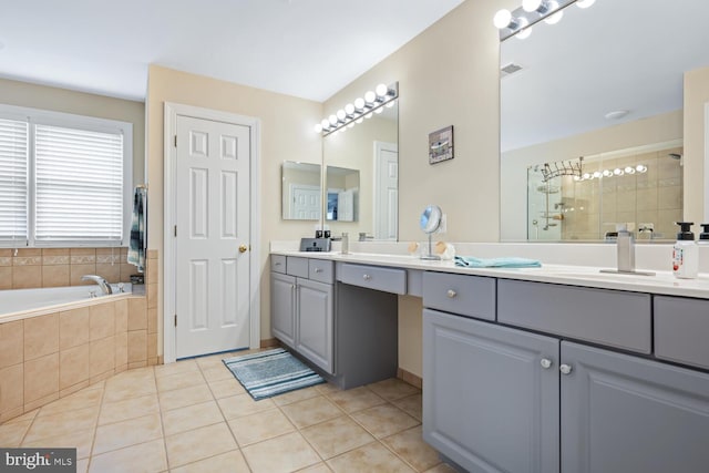 bathroom featuring tile patterned flooring, vanity, and independent shower and bath