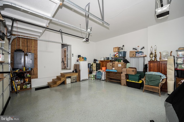 garage featuring a garage door opener and electric panel