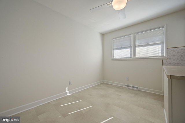 unfurnished room with ceiling fan