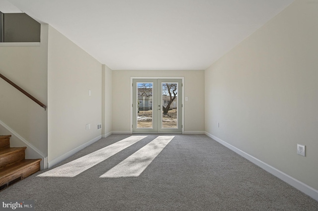 empty room with french doors and carpet