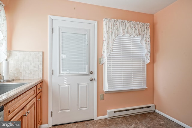 entryway featuring sink and baseboard heating