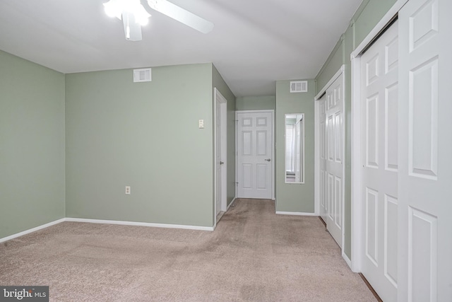 corridor with light colored carpet