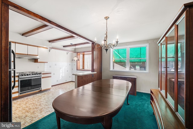 dining space featuring beamed ceiling, a healthy amount of sunlight, and an inviting chandelier