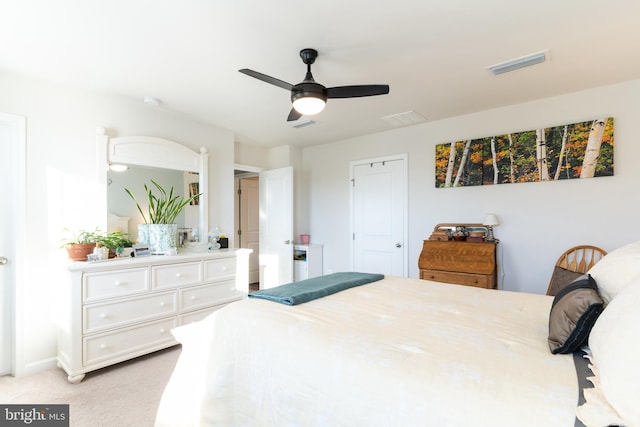 bedroom featuring light carpet and ceiling fan