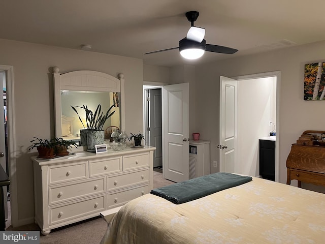 bedroom with ceiling fan and light colored carpet