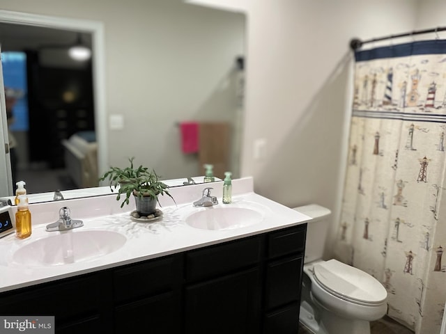 bathroom with vanity and toilet