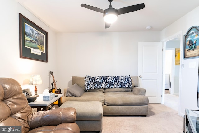 living room with ceiling fan and light carpet