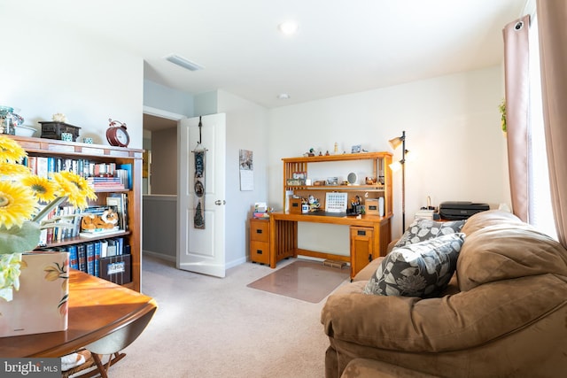 living room featuring light carpet