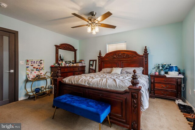 carpeted bedroom featuring ceiling fan