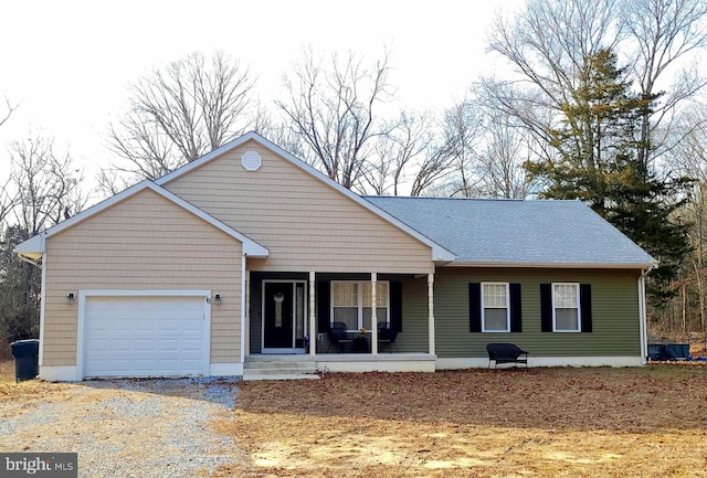 ranch-style house with a garage and covered porch