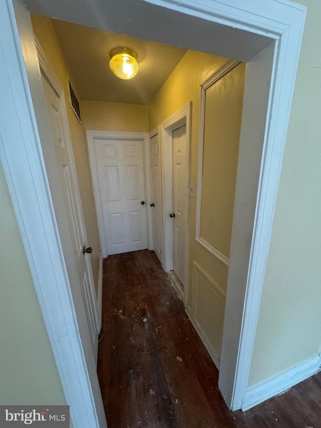 hallway featuring dark wood-type flooring