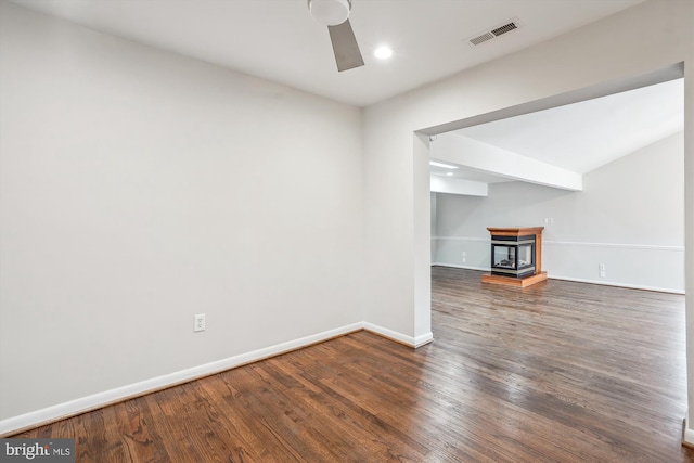 unfurnished living room with visible vents, baseboards, ceiling fan, and wood finished floors