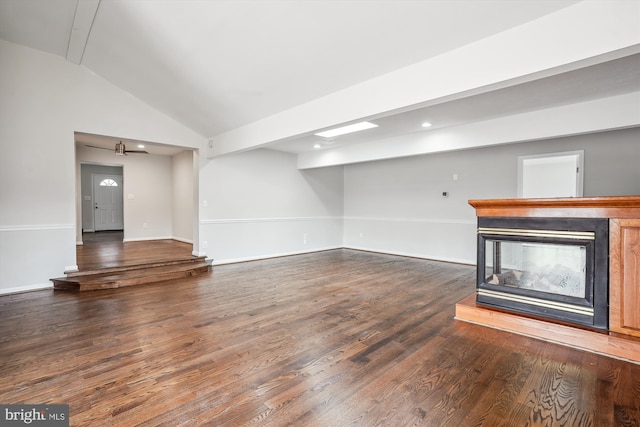 unfurnished living room featuring lofted ceiling, baseboards, a multi sided fireplace, and wood finished floors