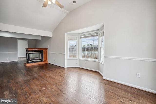 unfurnished living room with lofted ceiling, visible vents, a ceiling fan, a glass covered fireplace, and wood finished floors