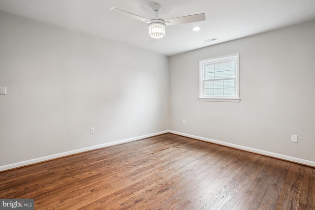 spare room featuring recessed lighting, visible vents, ceiling fan, wood finished floors, and baseboards