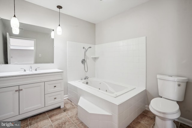 bathroom featuring tile patterned flooring, toilet, vanity, baseboards, and a combined bath / shower with jetted tub