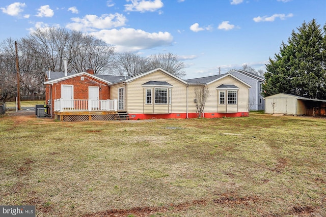 view of front of house featuring a deck, cooling unit, crawl space, a front lawn, and a chimney