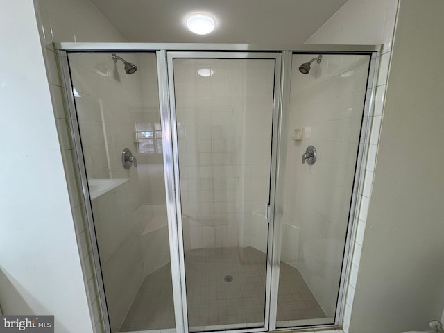 bathroom featuring walk in shower