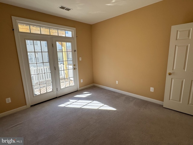 entryway with light colored carpet