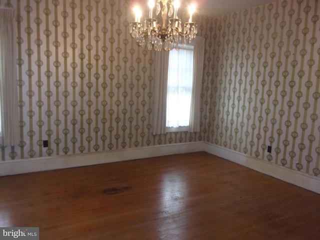 spare room with wood-type flooring