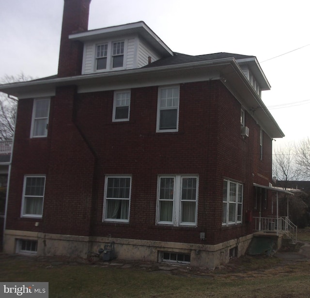 view of home's exterior with a lawn