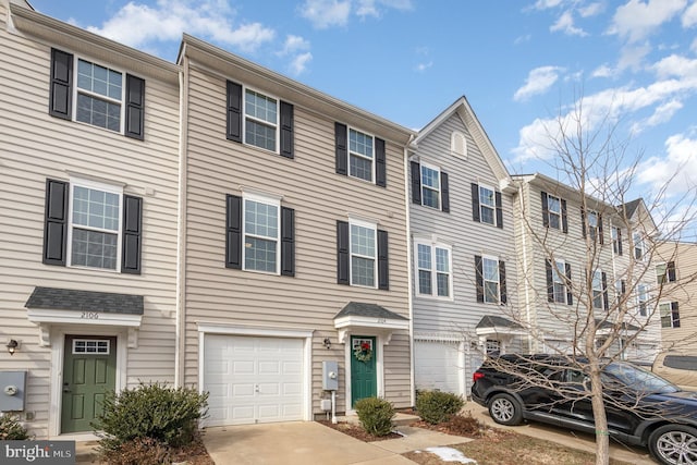 multi unit property featuring a garage